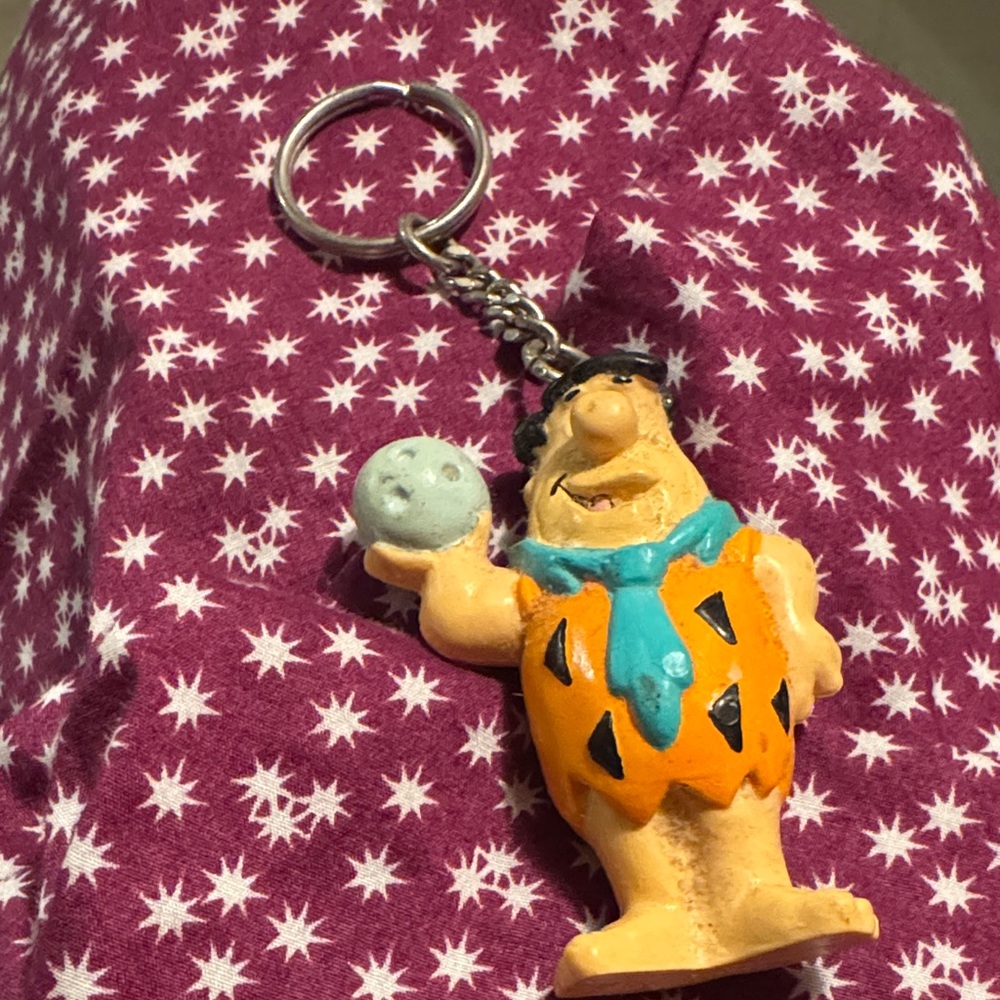 Fred Flintstone Cartoon Character Keychain with Orange and Blue Accents
